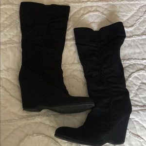 Tall black knee high boots with heel